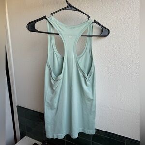 Lululemon Swiftly Tank. Never worn. Size 4. Hip length.
